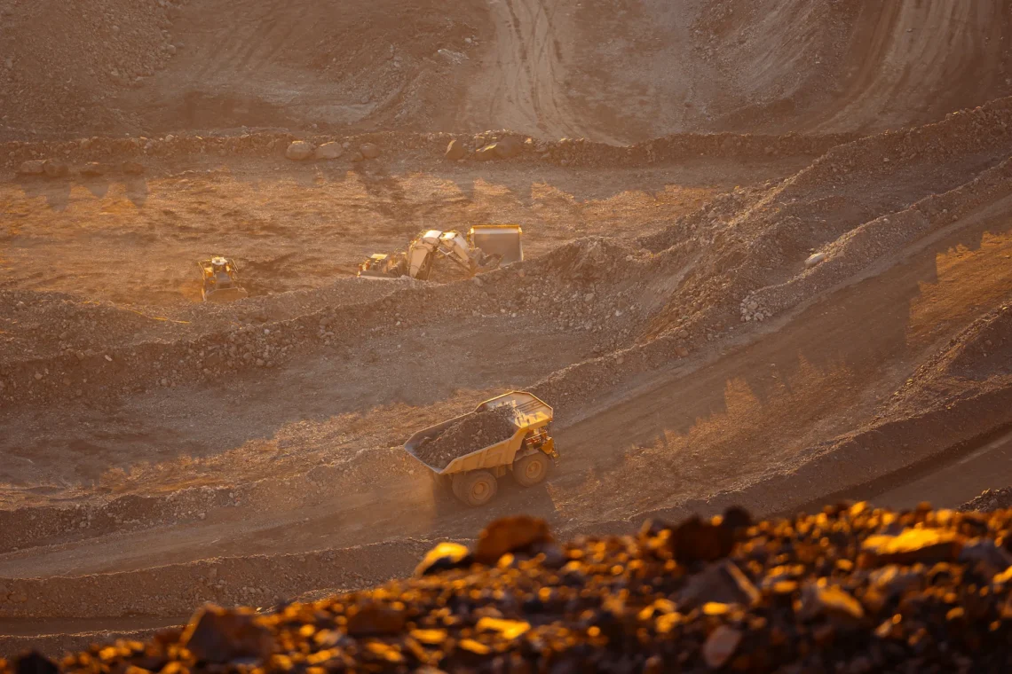 Aerial view of an open-cut mine with a haul truck